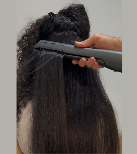DCS in use on thick curly hair, drying and straightening at the same time